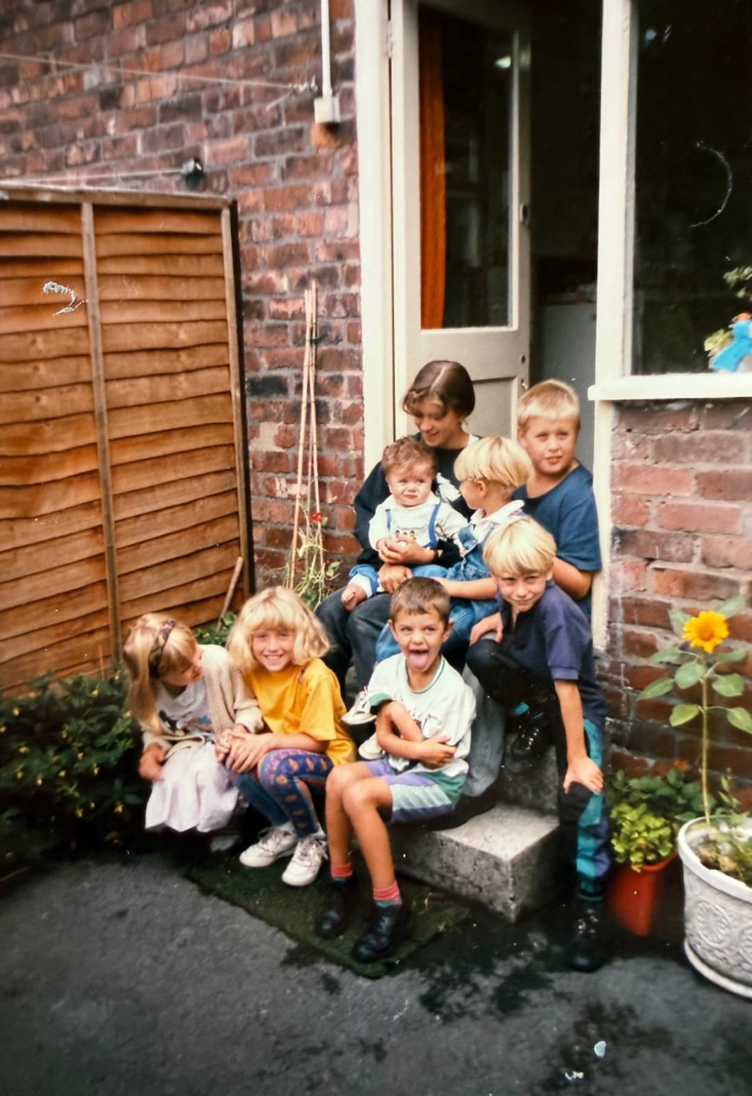 A family gathered together on a doorstep